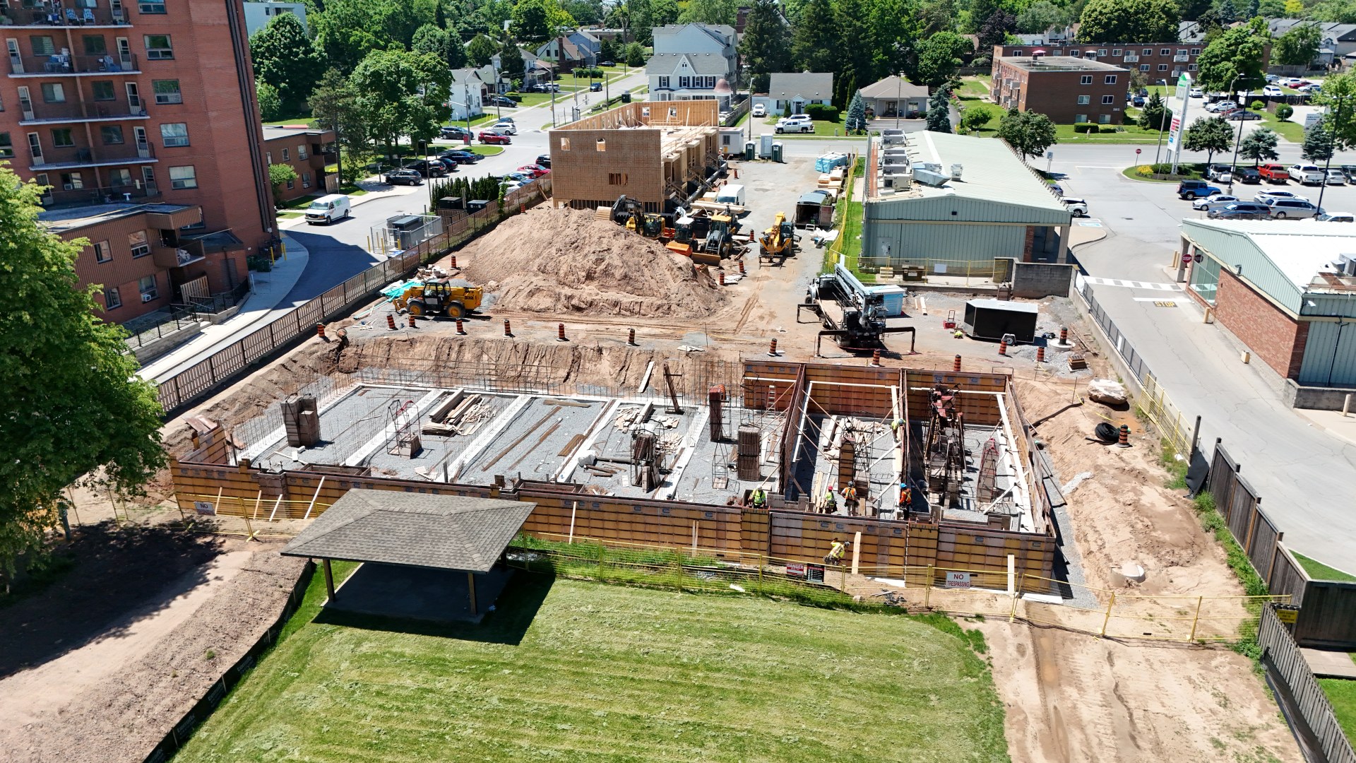Parkside39 Apartments — Wide site aerial, Block A framing and Block B foundations, June 2026