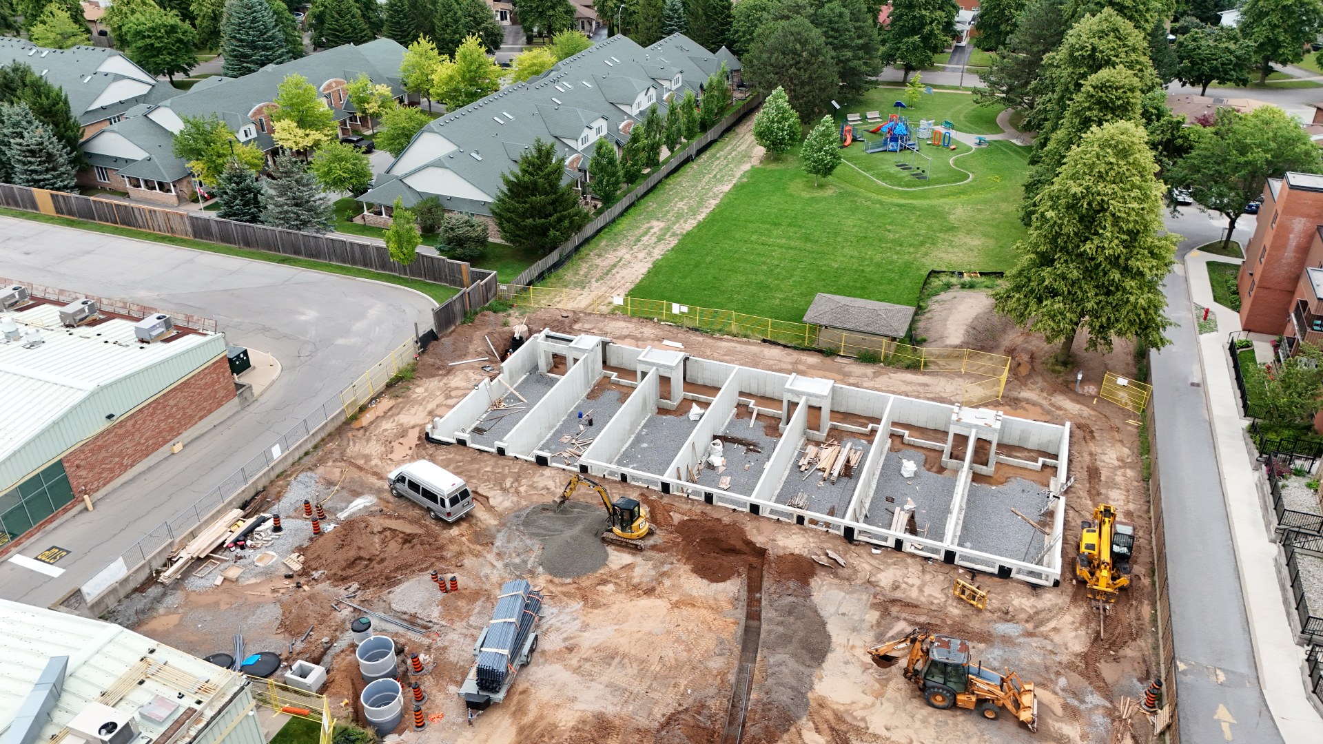 Parkside39 Apartments — Block B foundation walls complete, aerial, July 2026